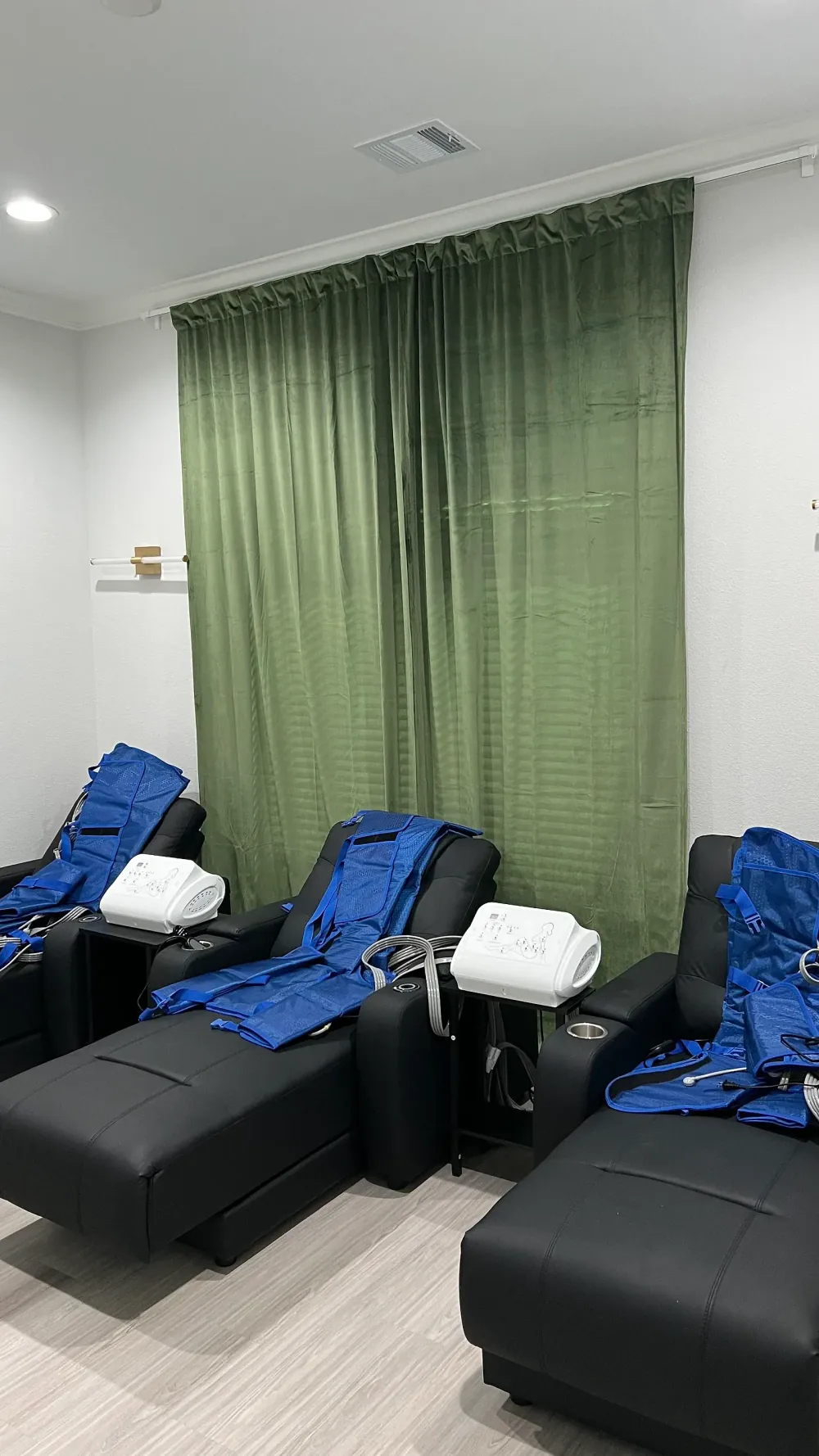 Compression therapy recliners with blue compression suits at 360 IV Infusion and Wellness