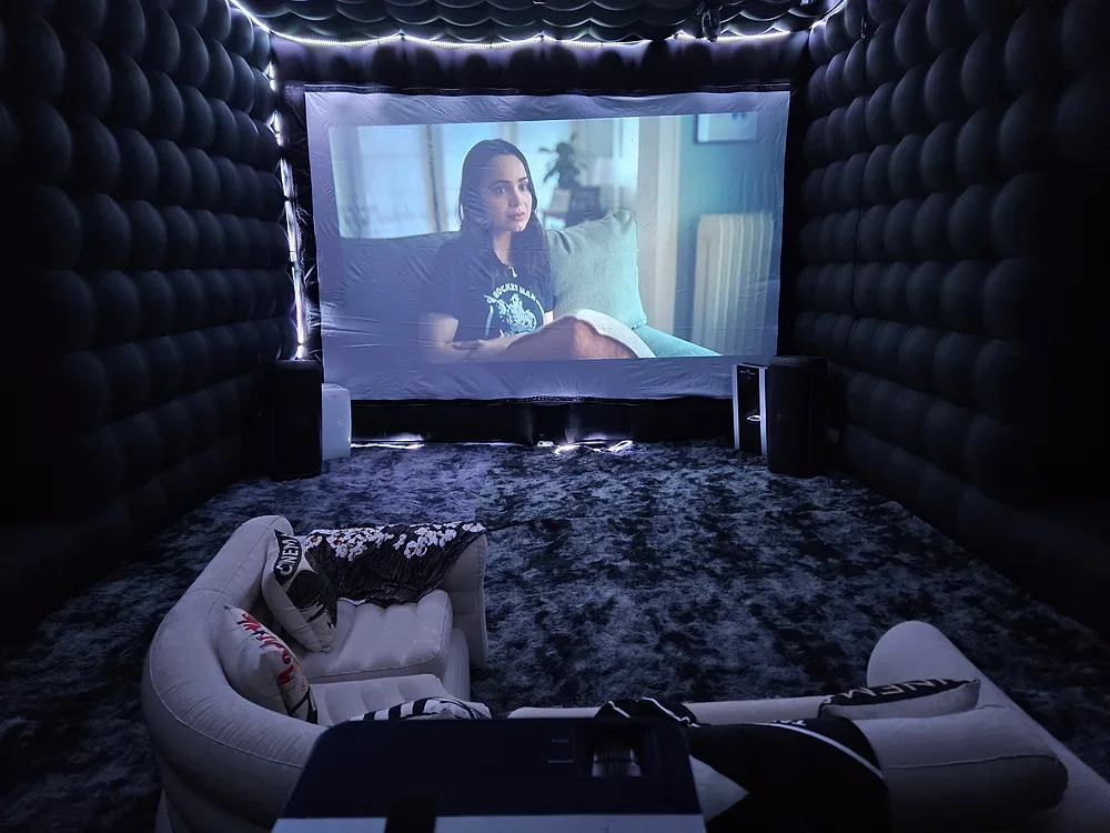 Indoor inflatable theater interior with movie playing — Backyard Movie Theater