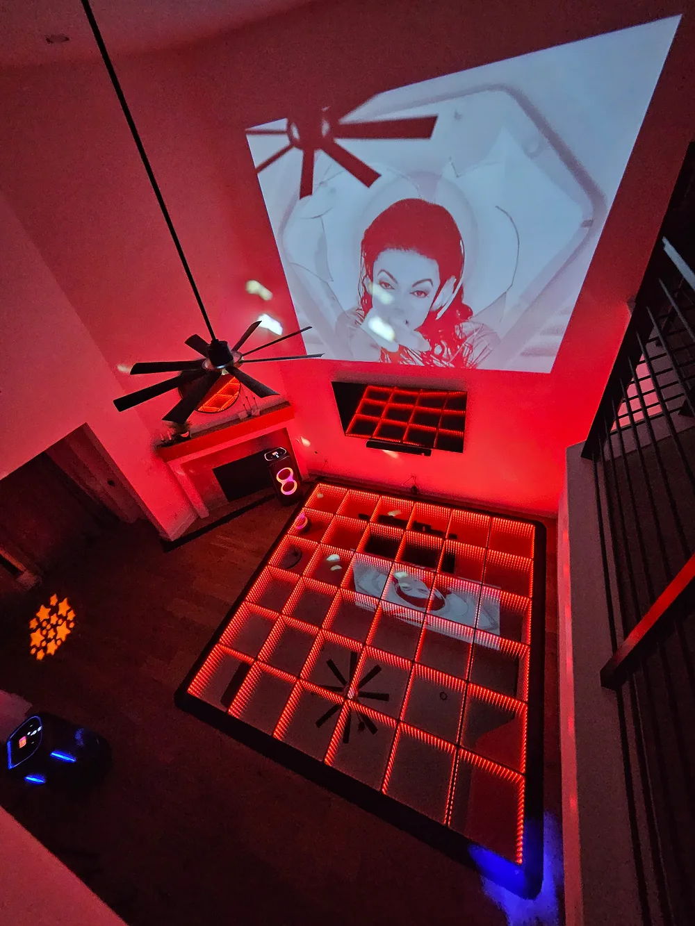 Inflatable nightclub setup with red lighting and projection screen — Backyard Movie Theater