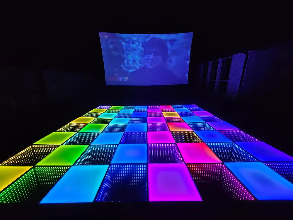 Outdoor rainbow LED dance floor under the movie screen — Backyard Movie Theater