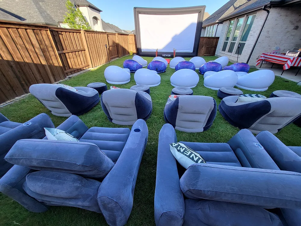 Backyard Movie Theater outdoor setup with rows of inflatable couches ready for a Prosper, TX event