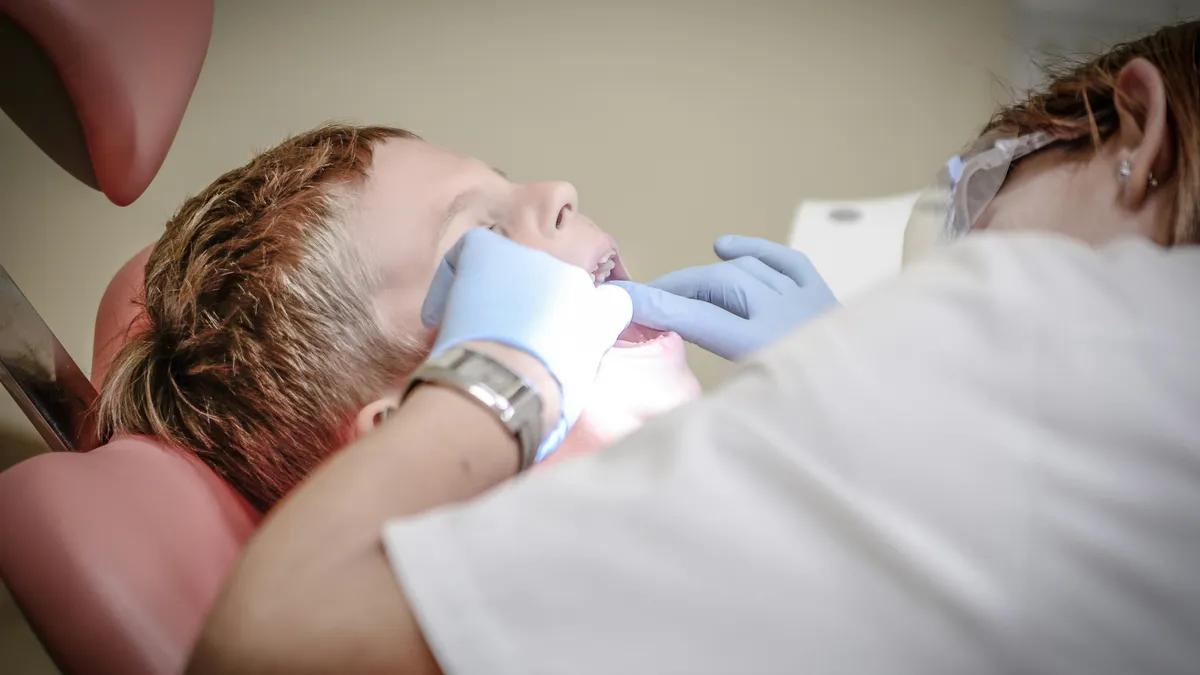 Child smiling during pediatric dental visit in Prosper TX