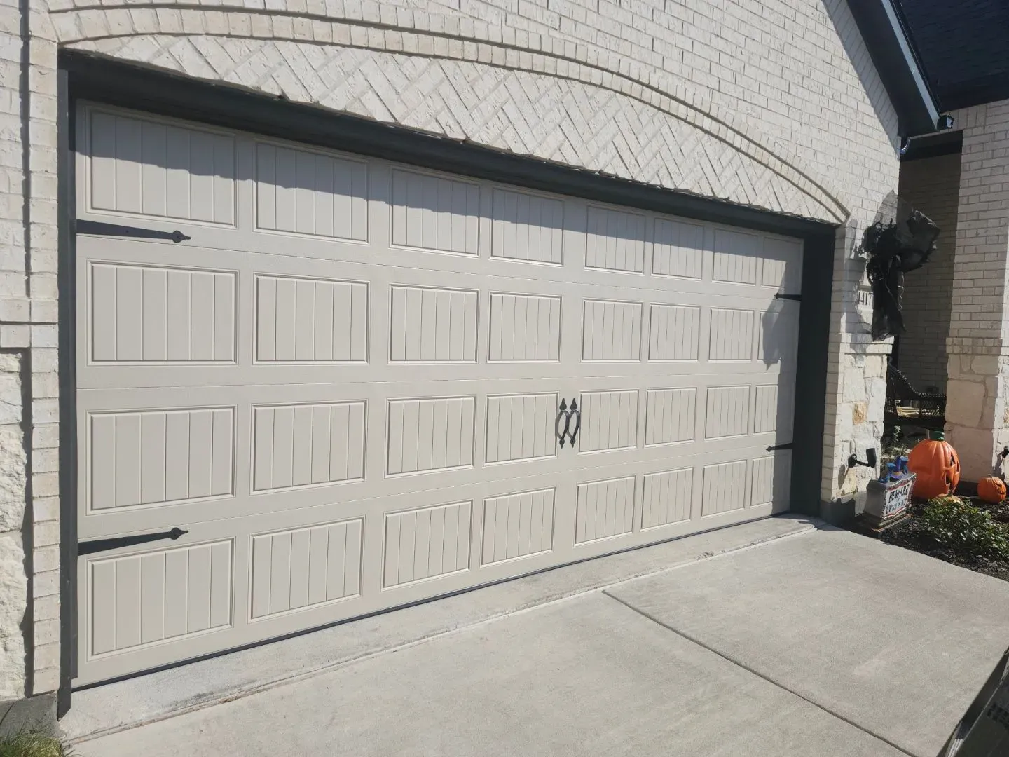 Carriage style garage door with decorative hardware installed by Close Automatic Garage Door