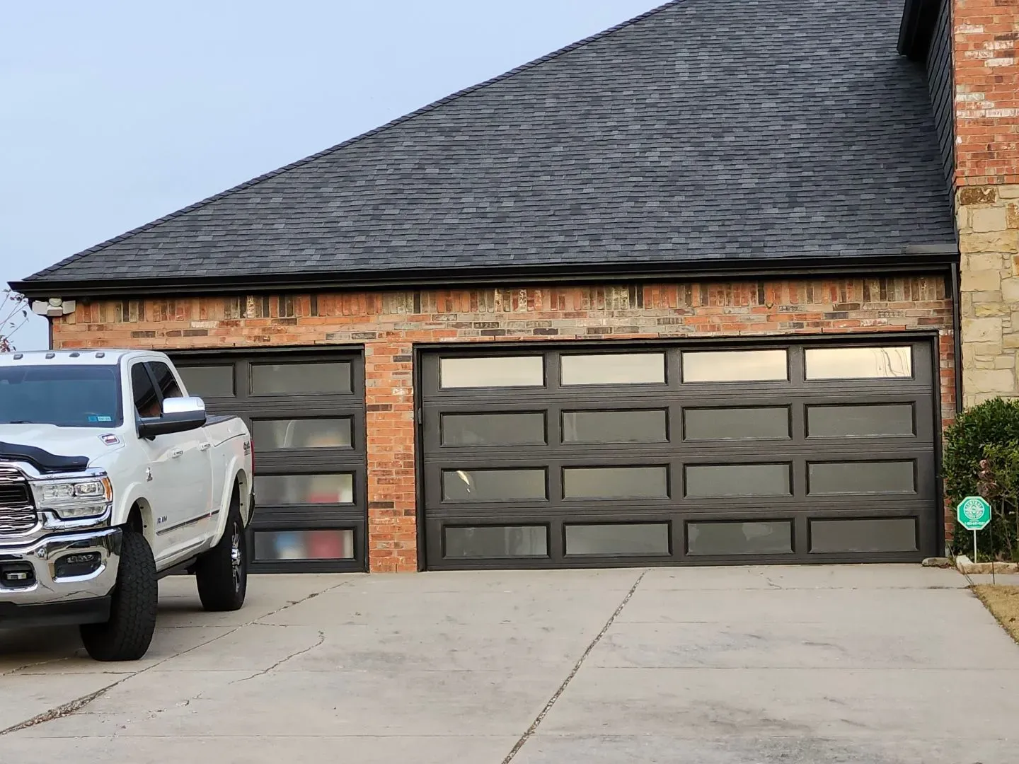 Modern garage doors with glass panels installed by Close Automatic Garage Door