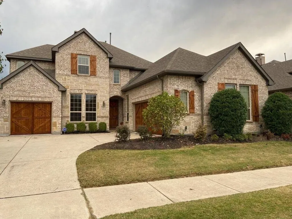 Beautiful wood garage door installation by Close Automatic Garage Door in the Prosper, TX area